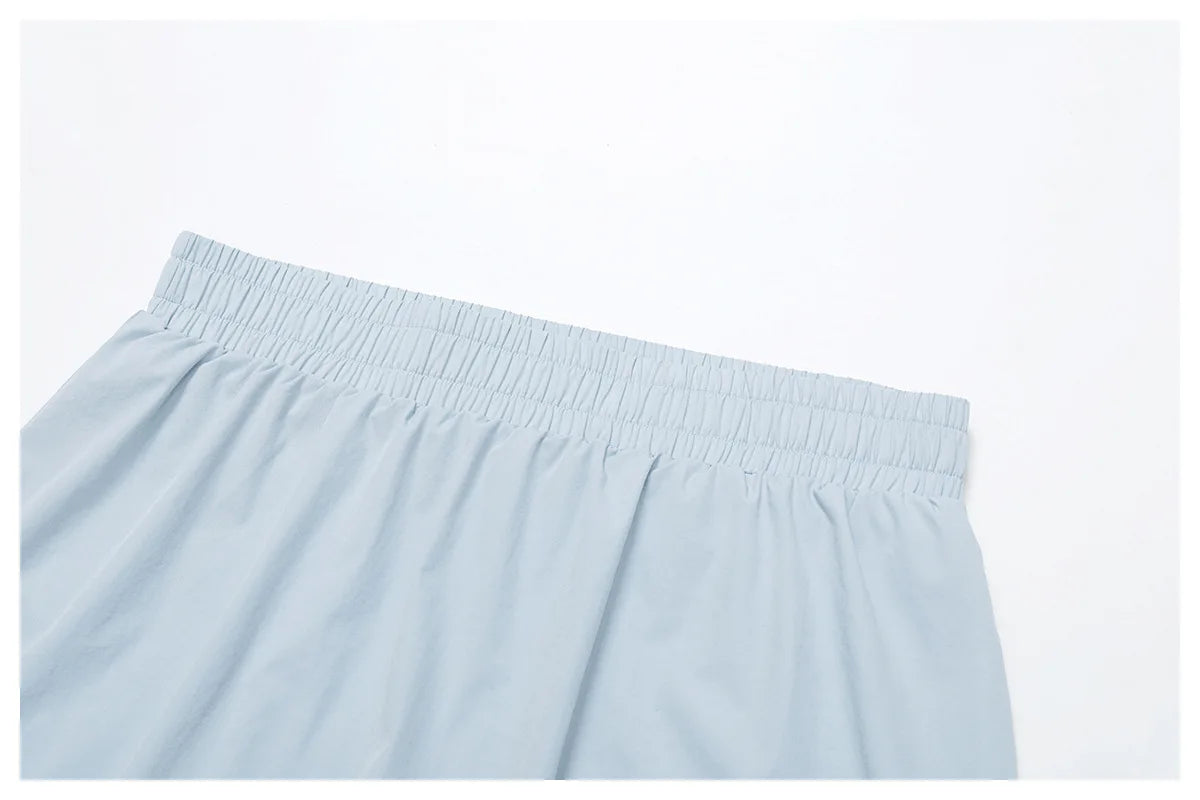 Light blue elastic waistband skirt on white background