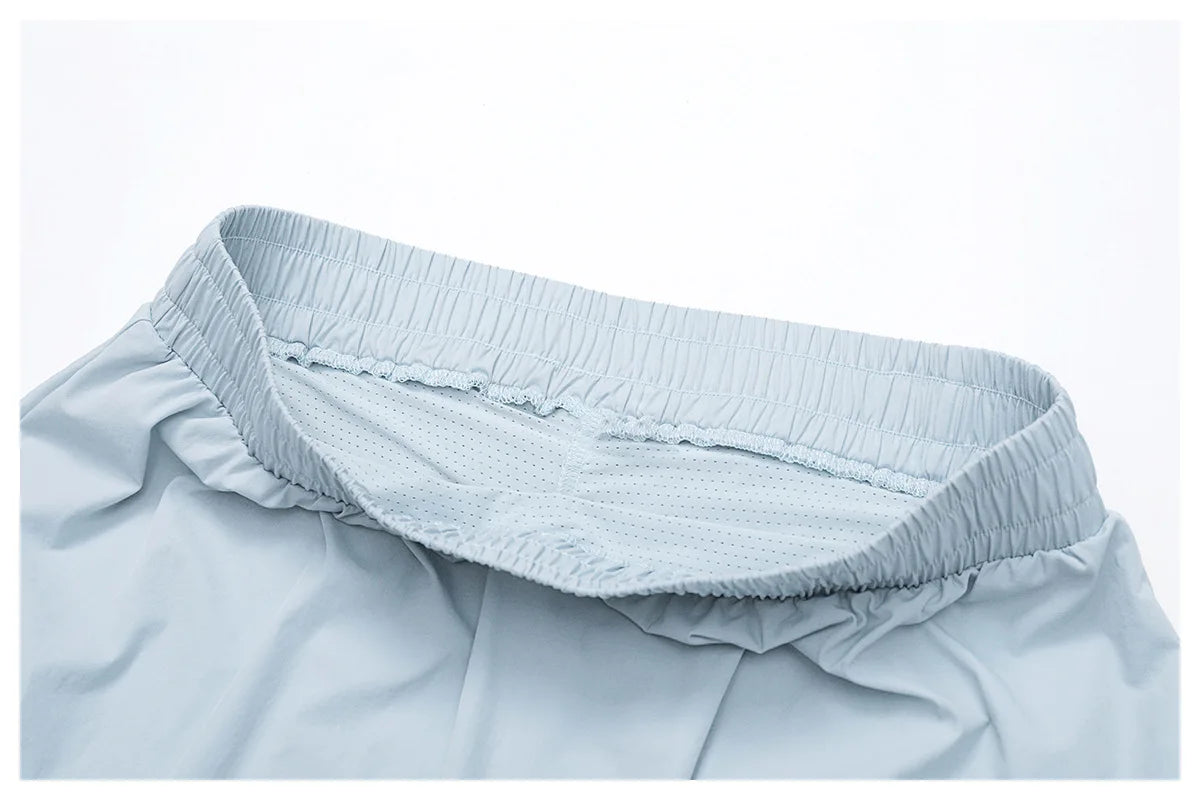 Light blue athletic shorts with elastic waistband and breathable mesh lining