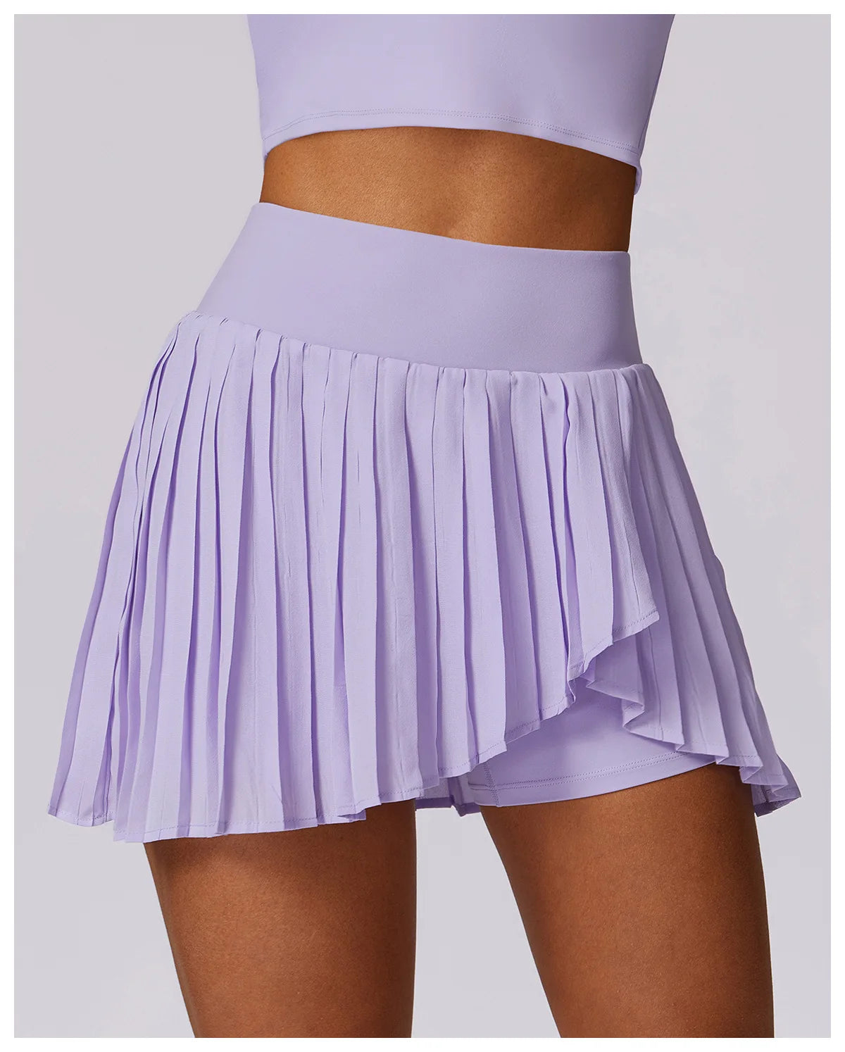 Lilac pleated tennis skirt with high waistband and inner shorts, athletic activewear