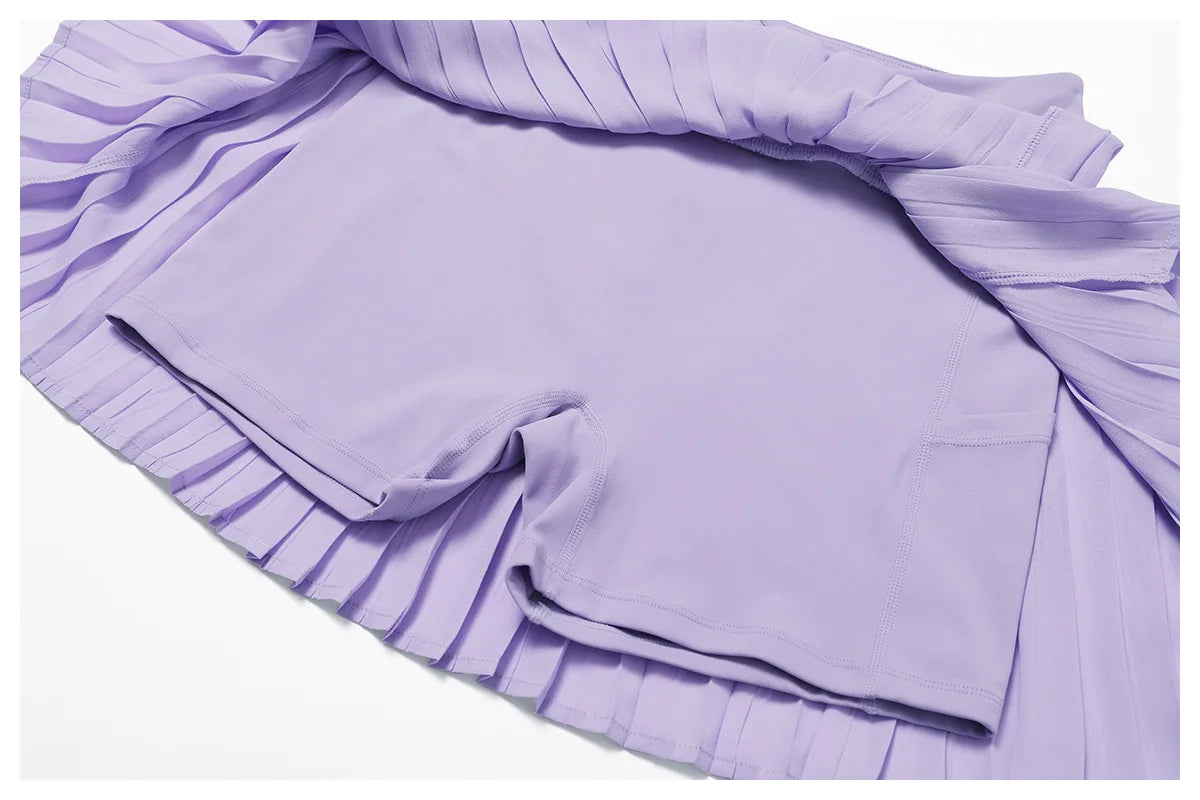 Lilac pleated athletic skirt with built-in shorts and side pocket, activewear detail view